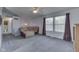 Living room with vaulted ceilings, ceiling fan, and large windows at 110 Meadow Creek Blvd, Whiteland, IN 46184