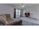 Living room featuring plush furniture, a ceiling fan, and a view through the windows at 110 Meadow Creek Blvd, Whiteland, IN 46184