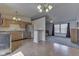 Open concept kitchen and living area with eat in bar, stainless steel appliances and carpet at 110 Meadow Creek Blvd, Whiteland, IN 46184