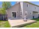 Large, flat backyard with a wooden deck and chair, perfect for entertaining or relaxing outdoors at 11424 Geist Valley Dr, Indianapolis, IN 46236