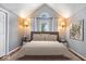 Bright bedroom with vaulted ceiling and arched window at 11424 Geist Valley Dr, Indianapolis, IN 46236