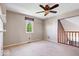 Spacious room with neutral carpet and a ceiling fan at 11424 Geist Valley Dr, Indianapolis, IN 46236