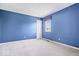 Blue bedroom with a double door at 11424 Geist Valley Dr, Indianapolis, IN 46236