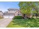 Charming two-story home with a two-car garage and well-maintained lawn at 11424 Geist Valley Dr, Indianapolis, IN 46236