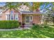 Inviting home exterior with brick facade, manicured lawn, and charming landscaping at 11424 Geist Valley Dr, Indianapolis, IN 46236