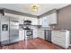 Contemporary kitchen with stainless steel appliances, granite counters, and ample cabinet space at 11424 Geist Valley Dr, Indianapolis, IN 46236