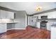 Updated kitchen with white cabinets, granite counters, and stainless steel appliances at 11424 Geist Valley Dr, Indianapolis, IN 46236