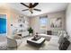 Inviting living room featuring a modern sofa, stylish decor, and a ceiling fan at 11424 Geist Valley Dr, Indianapolis, IN 46236
