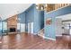 Spacious living area with fireplace, hardwood floors, and staircase access at 11424 Geist Valley Dr, Indianapolis, IN 46236