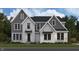 Charming two-story home with mixed material facade, including brick, and well-manicured lawn at 11801 Sage Creek Bnd, Fishers, IN 46037