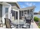 Charming patio with outdoor seating, overlooking a well-maintained backyard and screened-in porch at 1275 Cliff View Dr, Westfield, IN 46074