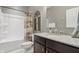 Well-maintained bathroom featuring a shower-tub combination and a vanity with a granite countertop at 1275 Cliff View Dr, Westfield, IN 46074