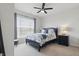 Comfortable bedroom with a black bed frame, natural light, and neutral carpet at 1275 Cliff View Dr, Westfield, IN 46074