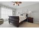Serene bedroom showcasing a traditional sleigh bed, complemented by soft lighting and elegant decor at 1275 Cliff View Dr, Westfield, IN 46074