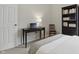Inviting bedroom with a functional desk area, perfect for work or study, next to a bookshelf at 1275 Cliff View Dr, Westfield, IN 46074