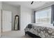 Bright bedroom with a patterned bed, ample natural light, and neutral walls at 1275 Cliff View Dr, Westfield, IN 46074