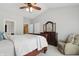 Serene bedroom with a dark wood sleigh bed, dresser, and sitting area at 1275 Cliff View Dr, Westfield, IN 46074
