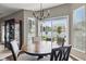 Cozy dining area with natural light, a chandelier, and views of the backyard at 1275 Cliff View Dr, Westfield, IN 46074