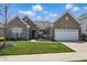 Charming brick home with a well-manicured lawn and inviting front entrance at 1275 Cliff View Dr, Westfield, IN 46074