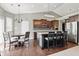 Modern kitchen with a center island, stainless steel appliances, and hardwood floors at 1275 Cliff View Dr, Westfield, IN 46074