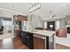 Open kitchen with a center island, stainless steel appliances, and seamless flow to the living room at 1275 Cliff View Dr, Westfield, IN 46074