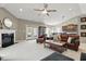 Bright living room featuring a fireplace, french doors, and a leather furniture set at 1275 Cliff View Dr, Westfield, IN 46074