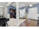 Open living space with a grand piano, built-in desk, and chair next to a bright window at 1275 Cliff View Dr, Westfield, IN 46074