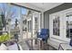 Inviting screened-in patio with cozy seating area and easy access to the backyard at 1275 Cliff View Dr, Westfield, IN 46074