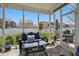 Relaxing screened-in patio with comfortable seating and outdoor view, great for entertaining at 1275 Cliff View Dr, Westfield, IN 46074