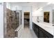 Modern bathroom with a tiled shower, double vanity, and a walk-in closet at 13323 Susser Way, Fishers, IN 46037