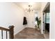 Inviting entryway featuring wood floors, a modern light fixture, and ample natural light at 13323 Susser Way, Fishers, IN 46037