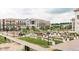 Community landscape featuring manicured gardens and architectural landmarks, all connected by a paved walkway at 13776 Tender Dr, Carmel, IN 46032