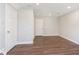 Spacious empty room features hardwood floors, recessed lighting, and two interior doors at 13776 Tender Dr, Carmel, IN 46032