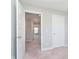 View into a hallway showing access to multiple rooms, neutral walls and carpet and clean, white doors at 13776 Tender Dr, Carmel, IN 46032