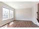 Bright and airy living room with hardwood floors and natural light from large windows at 13776 Tender Dr, Carmel, IN 46032
