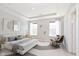 Spacious main bedroom with tray ceiling, large windows, and stylish modern furniture at 13776 Tender Dr, Carmel, IN 46032