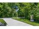 Scenic neighborhood entrance featuring lush trees and manicured lawns, creating a welcoming environment at 13776 Tender Dr, Carmel, IN 46032
