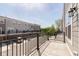 View from a private patio showing multiple townhomes and a parking area, offering an outdoor living experience at 13776 Tender Dr, Carmel, IN 46032