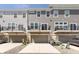 Contemporary townhomes featuring rear garages, balconies, and modern design providing stylish and functional living spaces at 13776 Tender Dr, Carmel, IN 46032