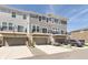 Modern townhome featuring balconies and garages, blending functionality with contemporary design, and offering outdoor living spaces at 13776 Tender Dr, Carmel, IN 46032