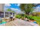 Spacious backyard with a wooden deck, grill, and a sun room at 1402 Arcola Ct, Beech Grove, IN 46107