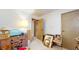 A bedroom space with a desk, decorations, and an open doorway at 1402 Arcola Ct, Beech Grove, IN 46107