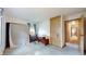 A bedroom space with a mattress, closet, and an open doorway at 1402 Arcola Ct, Beech Grove, IN 46107