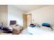 Bright bedroom featuring neutral walls and a single bed with colorful linens at 1402 Arcola Ct, Beech Grove, IN 46107