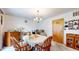 Bright dining area with chandelier, and wood furniture at 1402 Arcola Ct, Beech Grove, IN 46107