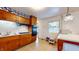 Well-lit kitchen featuring wooden cabinets, a gas stovetop, and tile backsplash at 1402 Arcola Ct, Beech Grove, IN 46107