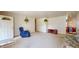 Inviting living room with cozy seating, neutral carpet, and bright natural light at 1402 Arcola Ct, Beech Grove, IN 46107