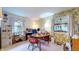 Functional home office featuring a desk, windows, and floral wallpaper at 1402 Arcola Ct, Beech Grove, IN 46107