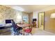 Functional home office featuring a desk, windows, and floral wallpaper at 1402 Arcola Ct, Beech Grove, IN 46107