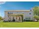 Spacious home with a well-manicured lawn, a charming pergola-covered patio, and mature trees at 14162 Nicholas Dr, Carmel, IN 46074